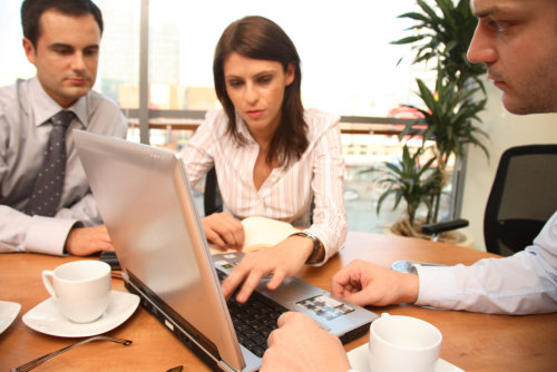 businessmen and business woman in a coffee shop